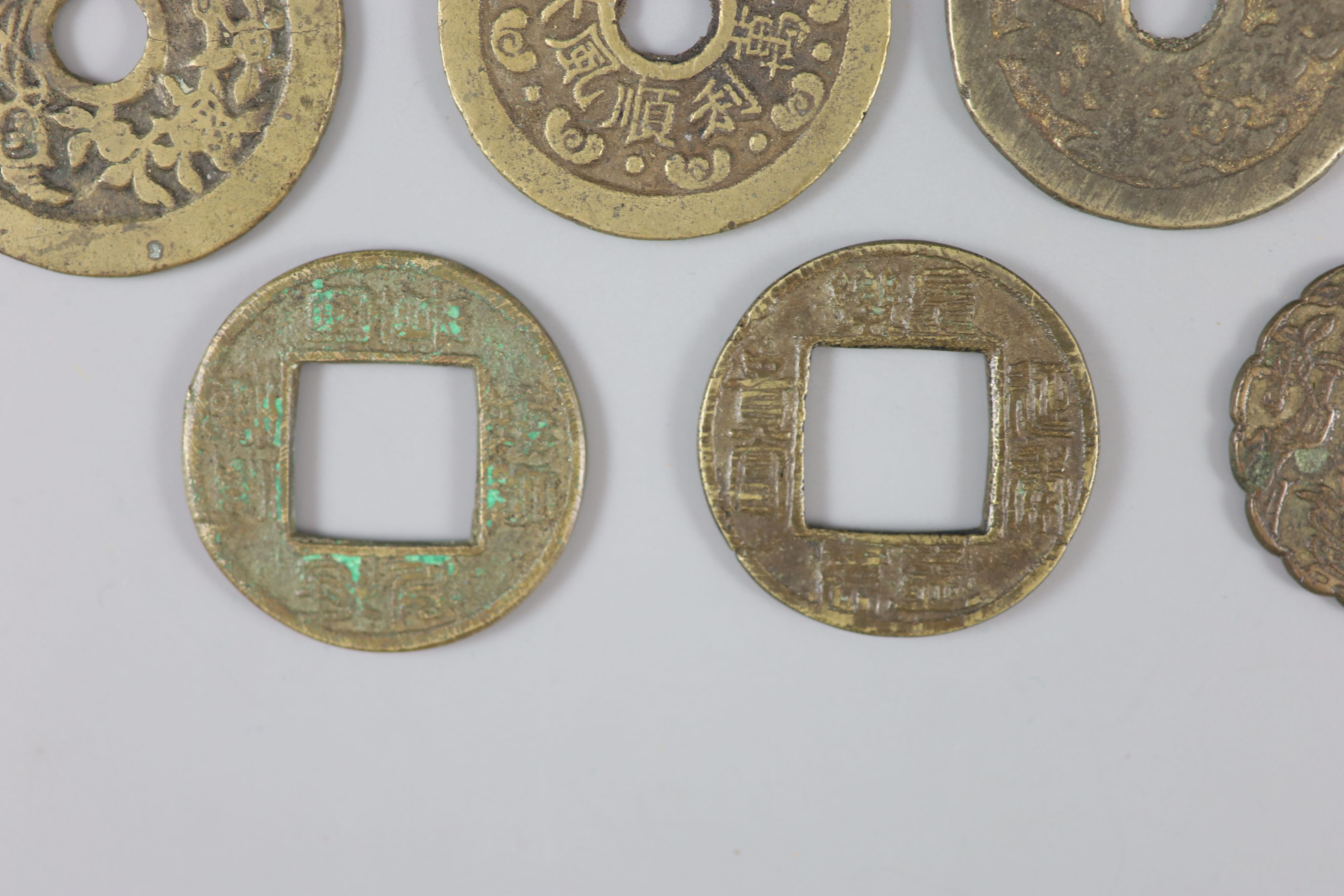 China, 14 cast bronze charms or amulets, Qing dynasty,